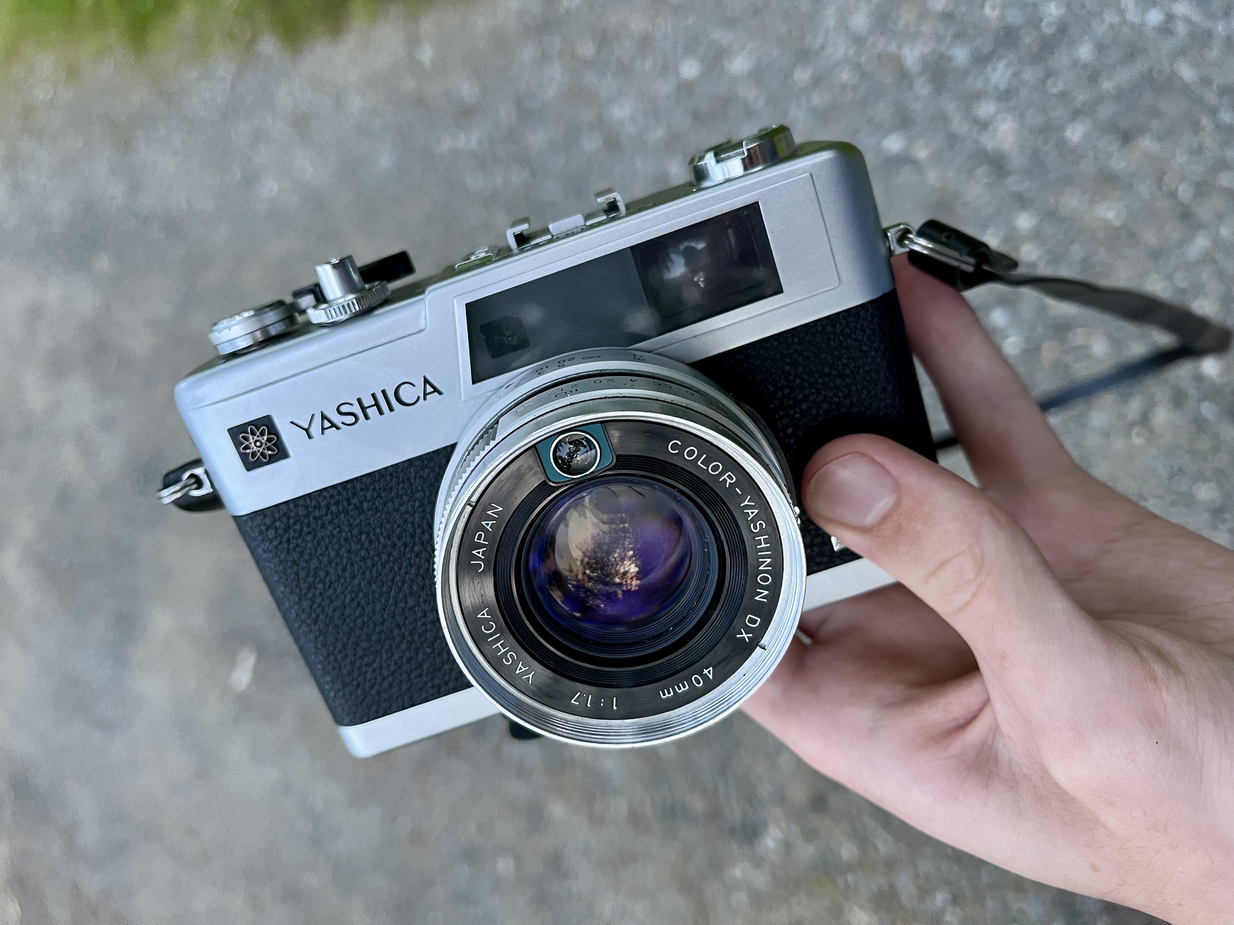 Yashica electro 35 gx held in one hand